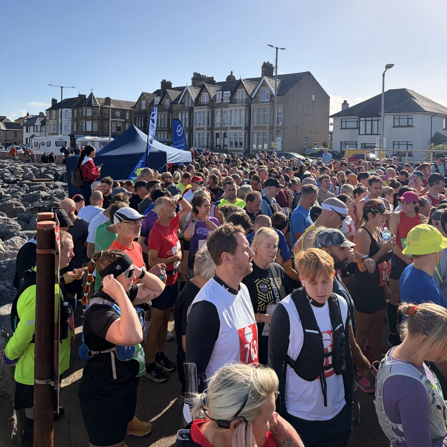 A large crowd of runners gathered beside the blue MOTRA stand on Morecambe’s promenade.